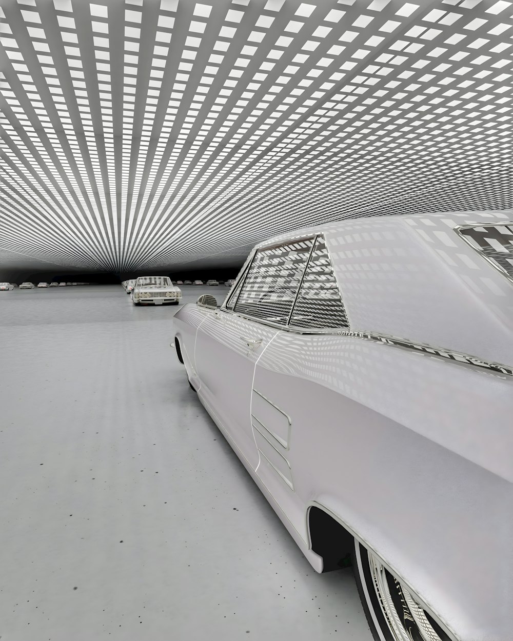 a white car parked in a parking garage