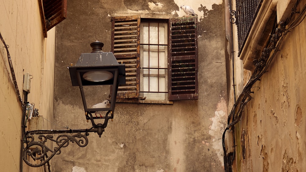 a street light on the side of a building