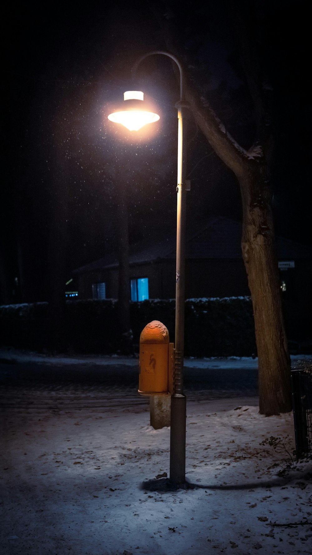 a street light sitting on the side of a road