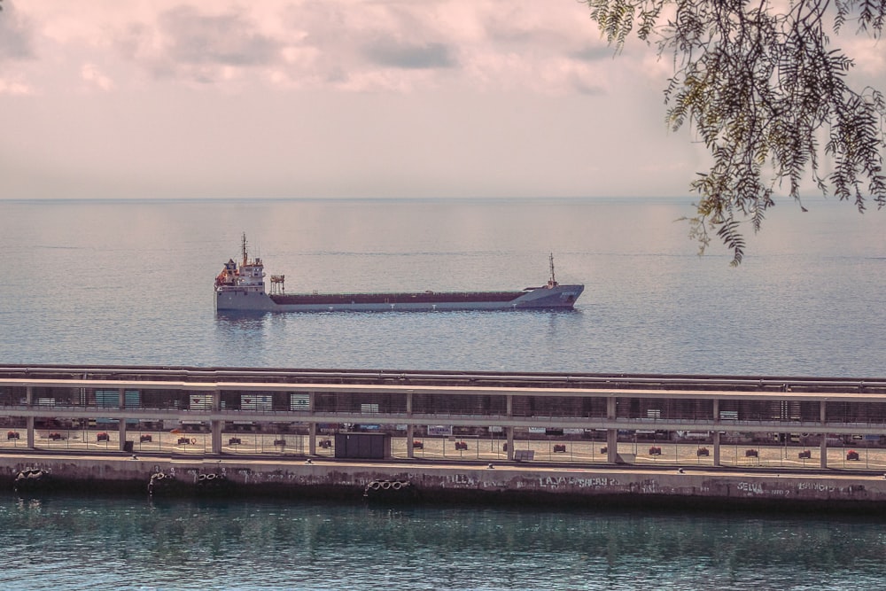 a large boat floating on top of a large body of water