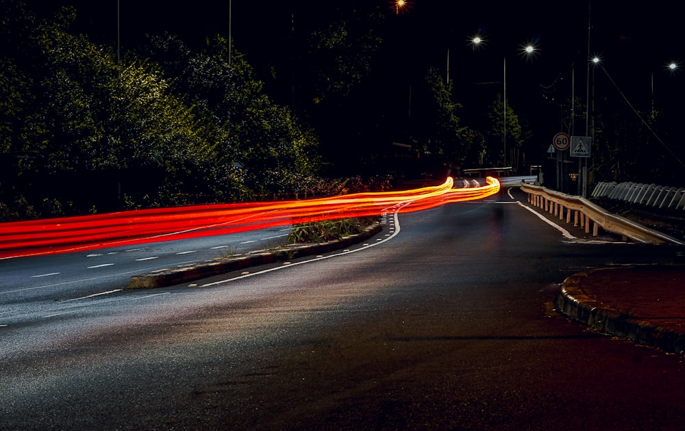 a long exposure photo of a street at night