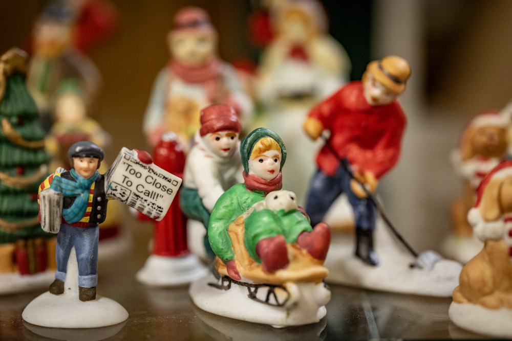 a group of figurines sitting on top of a table