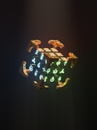 A glowing orb surrounded by ancient runes and digital code.