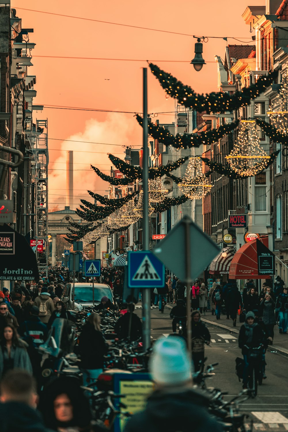 a crowded city street filled with lots of people