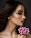 a woman with a rose in her hand