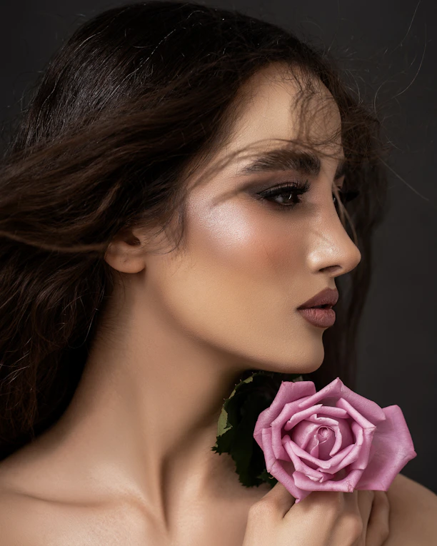 a woman with a rose in her hand