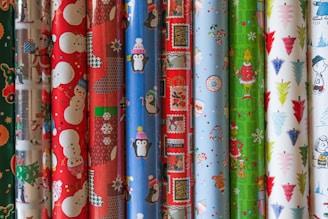 Colorful rolls of gift wrapping paper arranged in a neat display