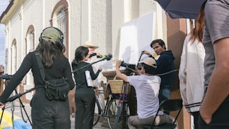 a group of people standing around each other