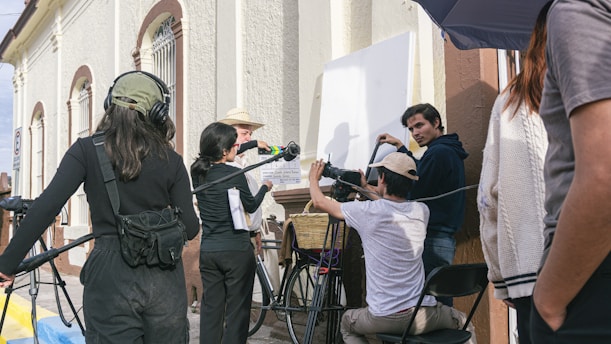 a group of people standing around each other