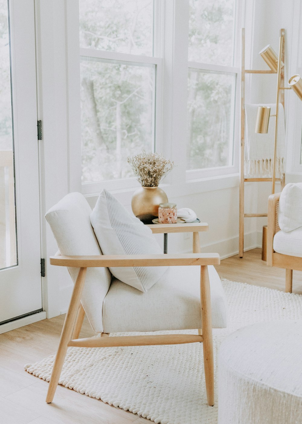 a living room with a chair and a table