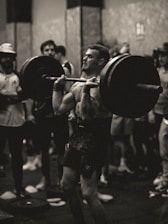 Close-up of athlete lifting weights in a strength and conditioning session.