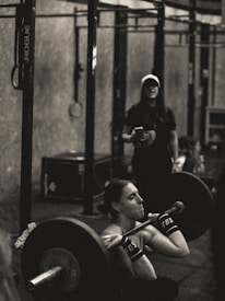 Close-up of a powerlifter's focused face during a squat lift.