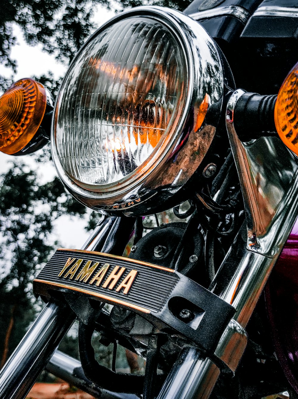 a close up of the headlight of a motorcycle