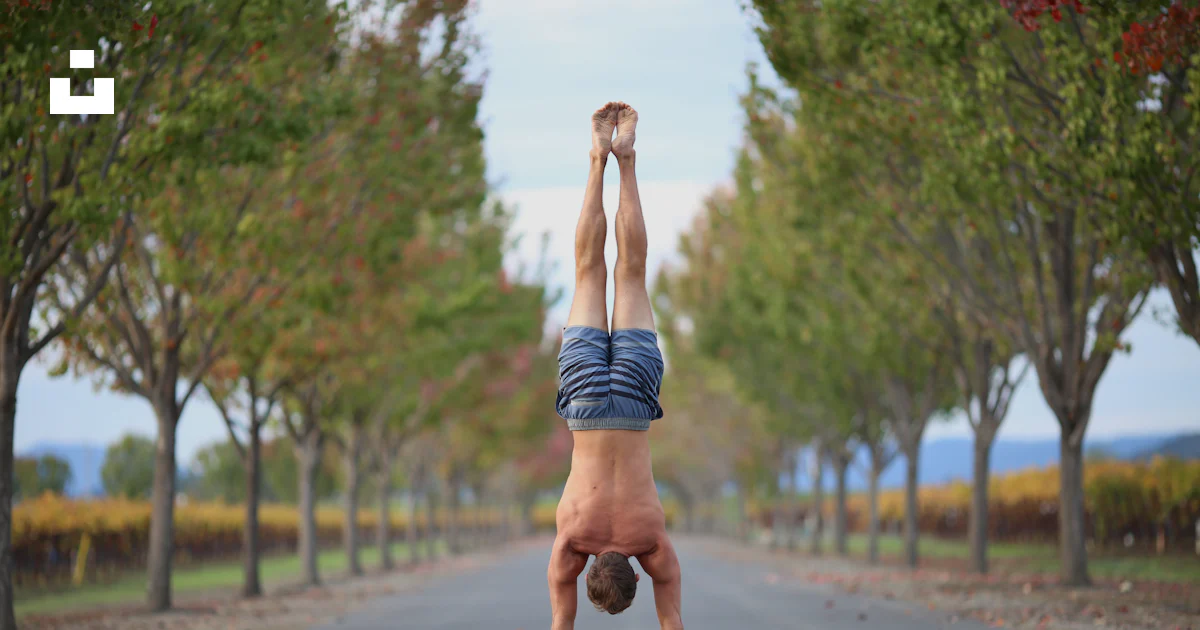 Handstand Outside A person doing a handstand in the middle of a road photo – Free ...