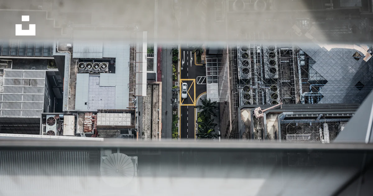 A view of a factory from a window photo – Free Singapore Image on Unsplash