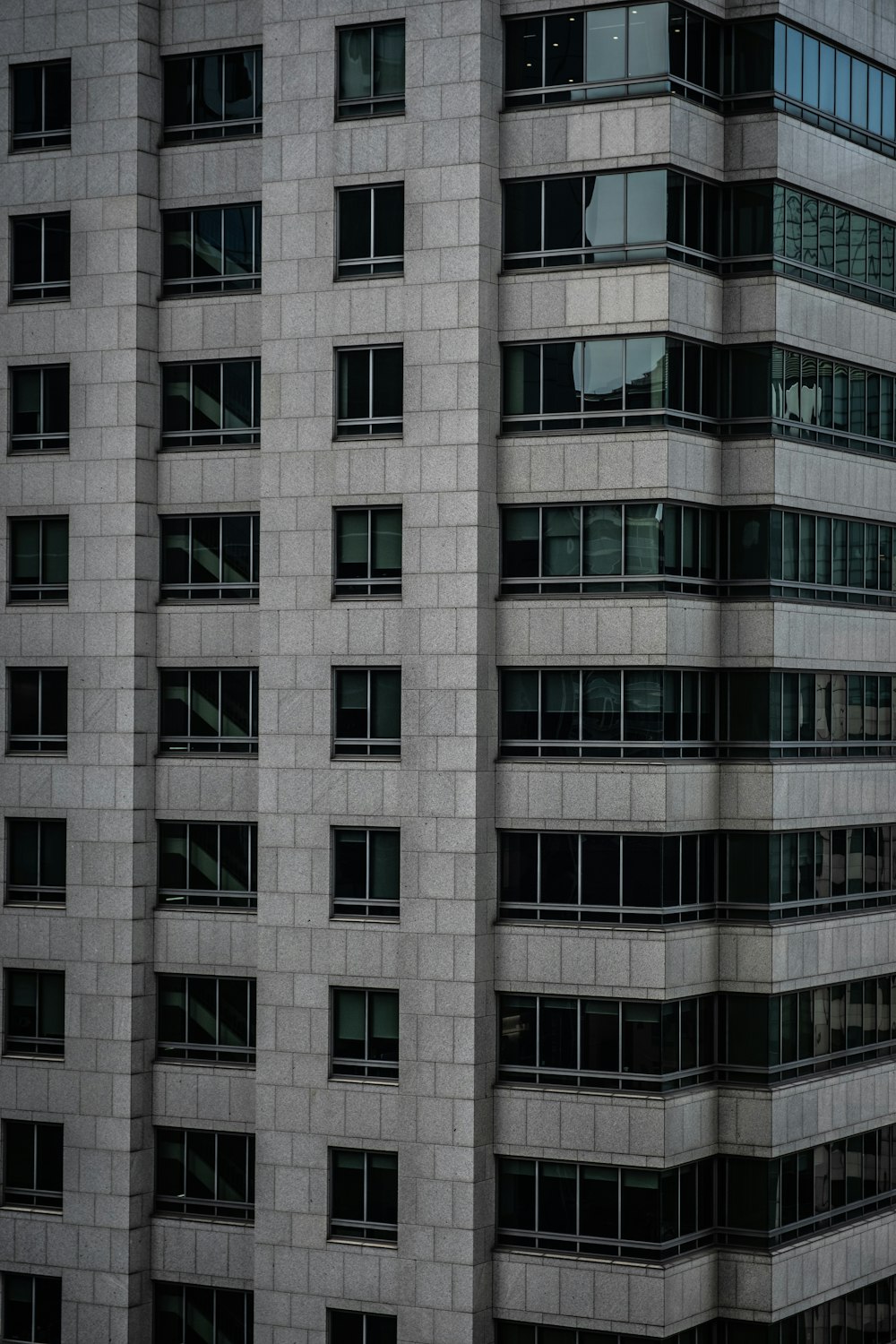 an airplane is flying in front of a building