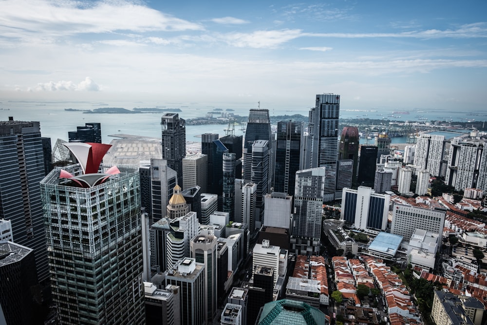 a view of a city with tall buildings and a body of water