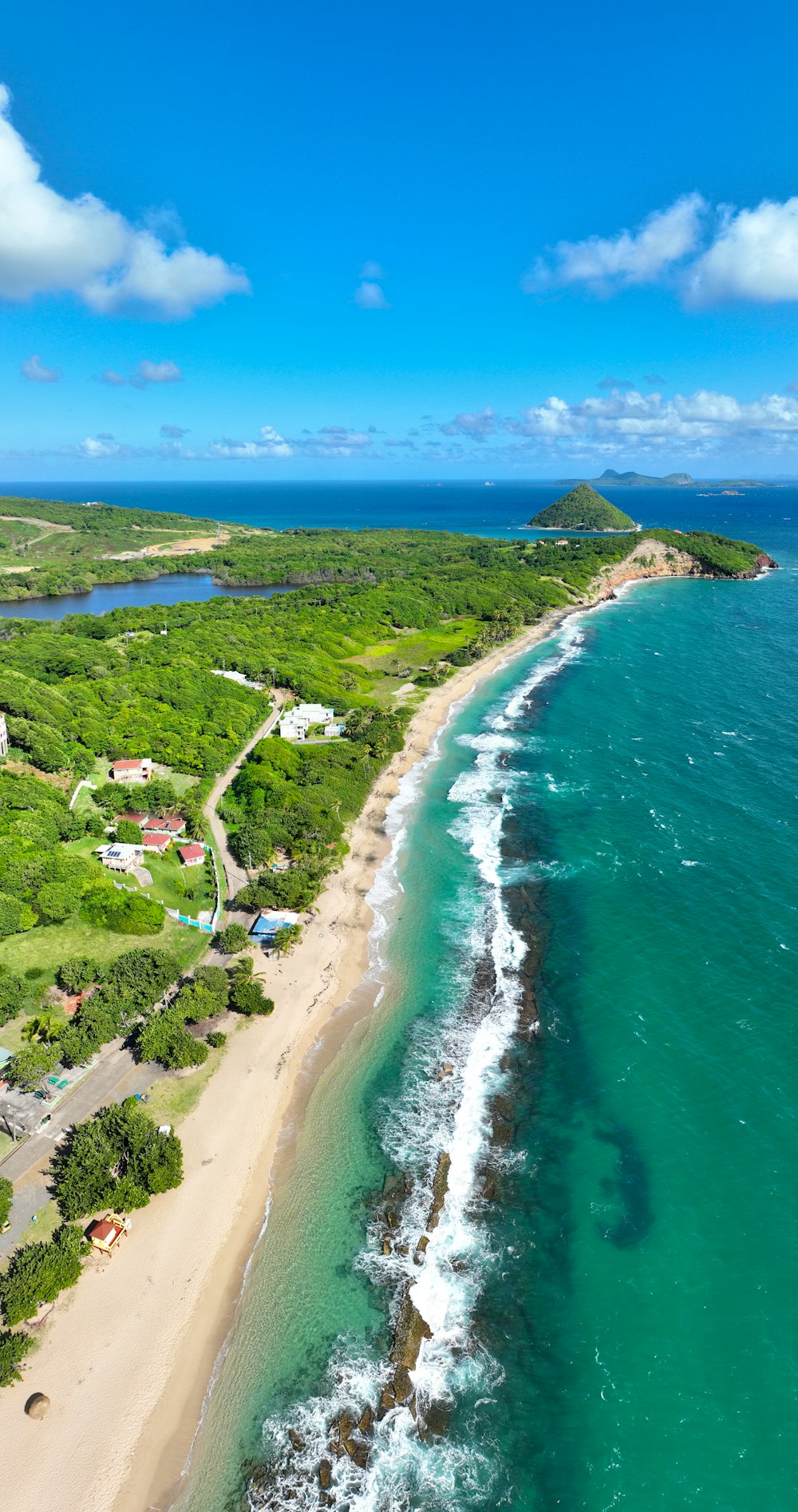 an aerial view of a beach and ocean