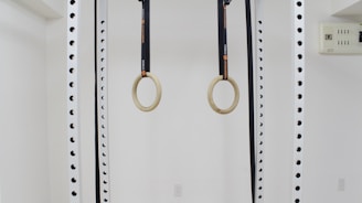 a pair of scissors hanging from a wall
