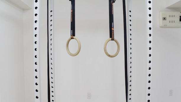 a pair of scissors hanging from a wall