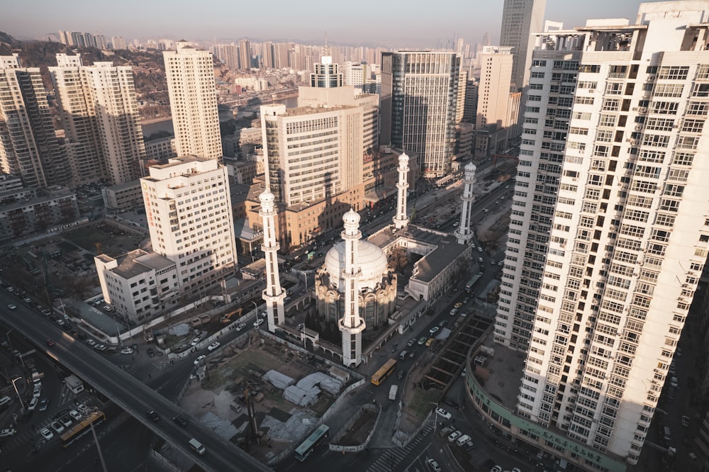 an aerial view of a city with tall buildings