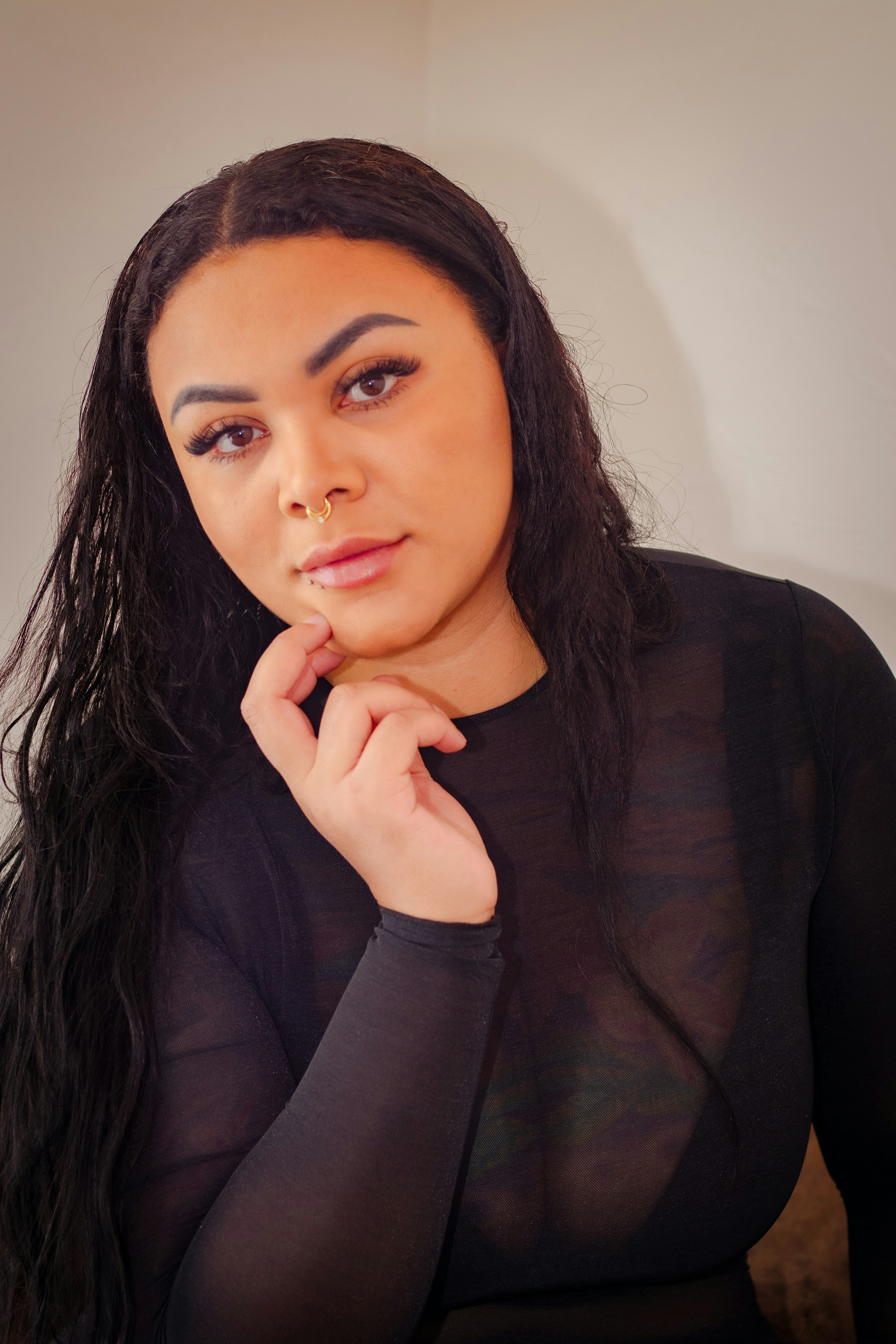 A woman with long black hair wearing a black shirt photo – Free Face ...