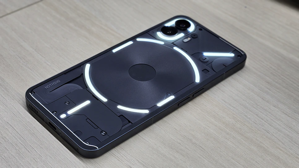 Close-up of a sleek transparent smartphone prototype with visible internal components.