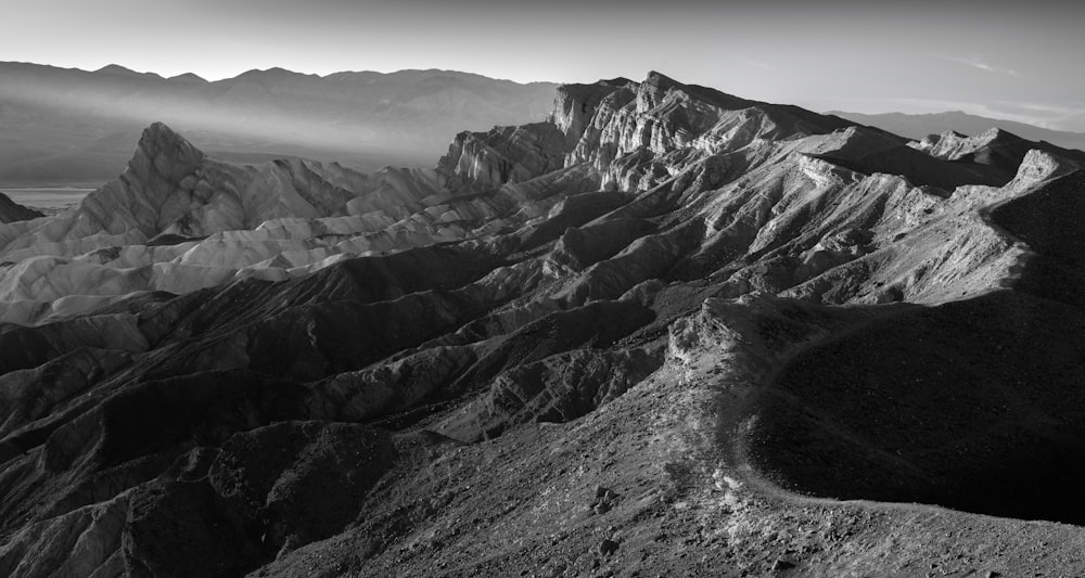 a black and white photo of a mountain range