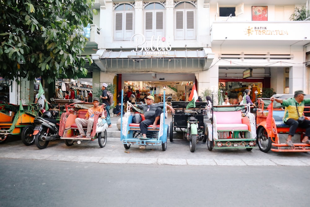 a group of people riding scooters down a street