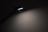 Modern pendant lamp casting soft light over a minimalist table.