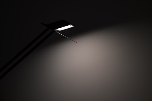 Modern pendant lamp casting soft light over a minimalist table.