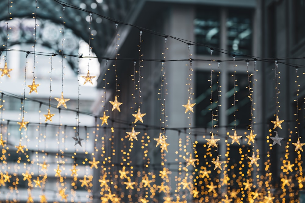 a string of gold stars hanging from a building