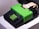A retro-style adding machine with a bright green cover and keypad. It features a numeric keypad and some function keys. A roll of paper is partially extended behind it.