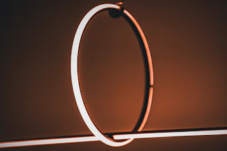 Elegant lighting fixture casting warm shadows over a minimalist space.