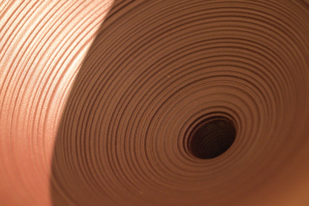 a roll of brown paper sitting on top of a table