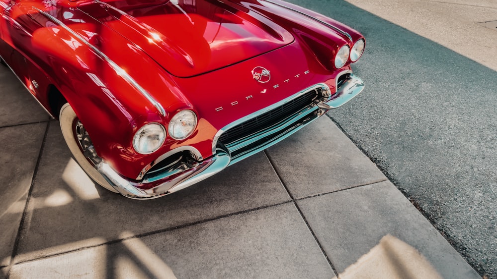 a red car parked on the side of the road