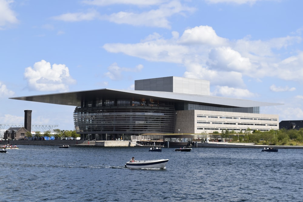 a boat in a body of water near a building