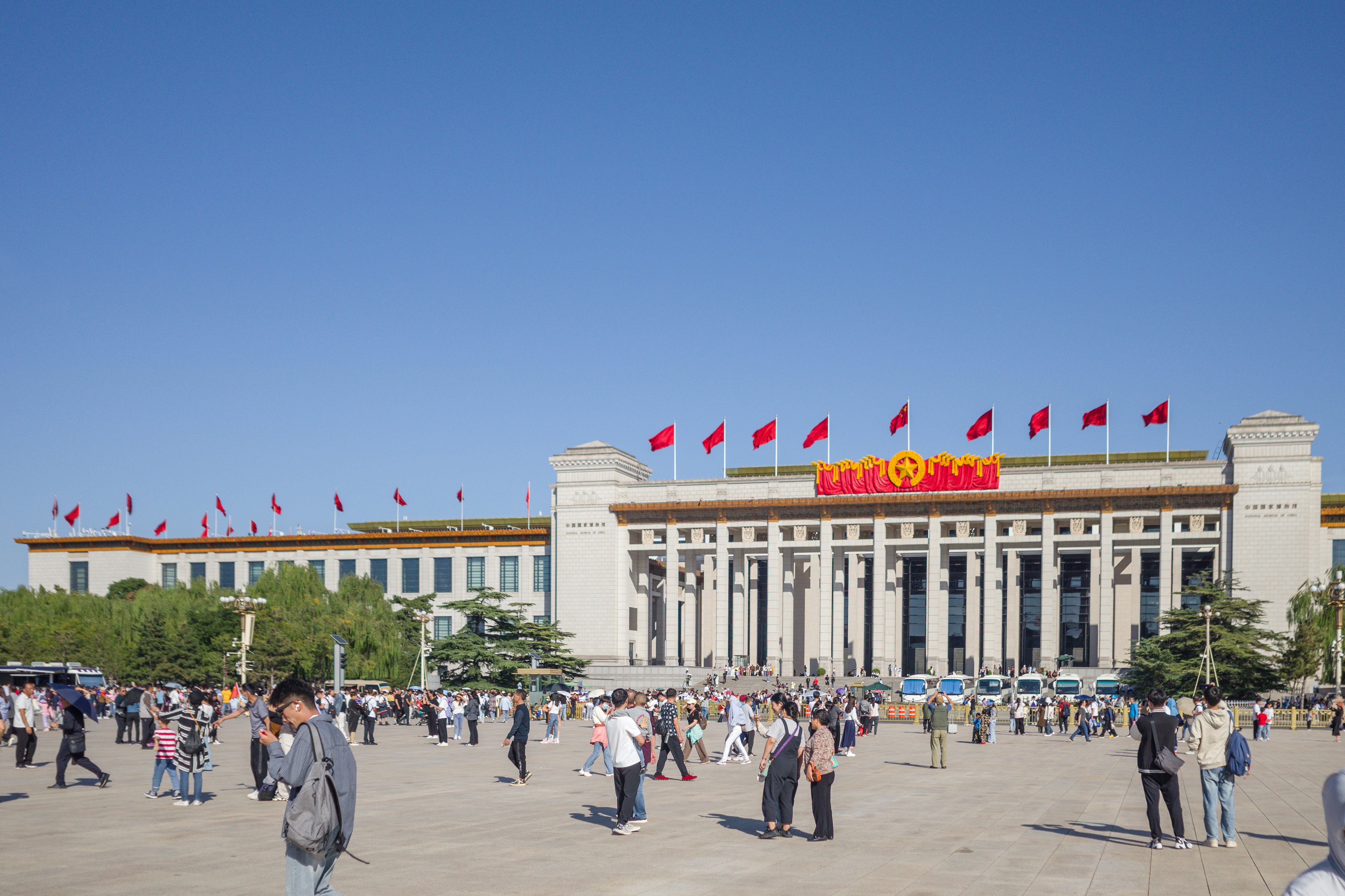 a group of people standing in front of a building