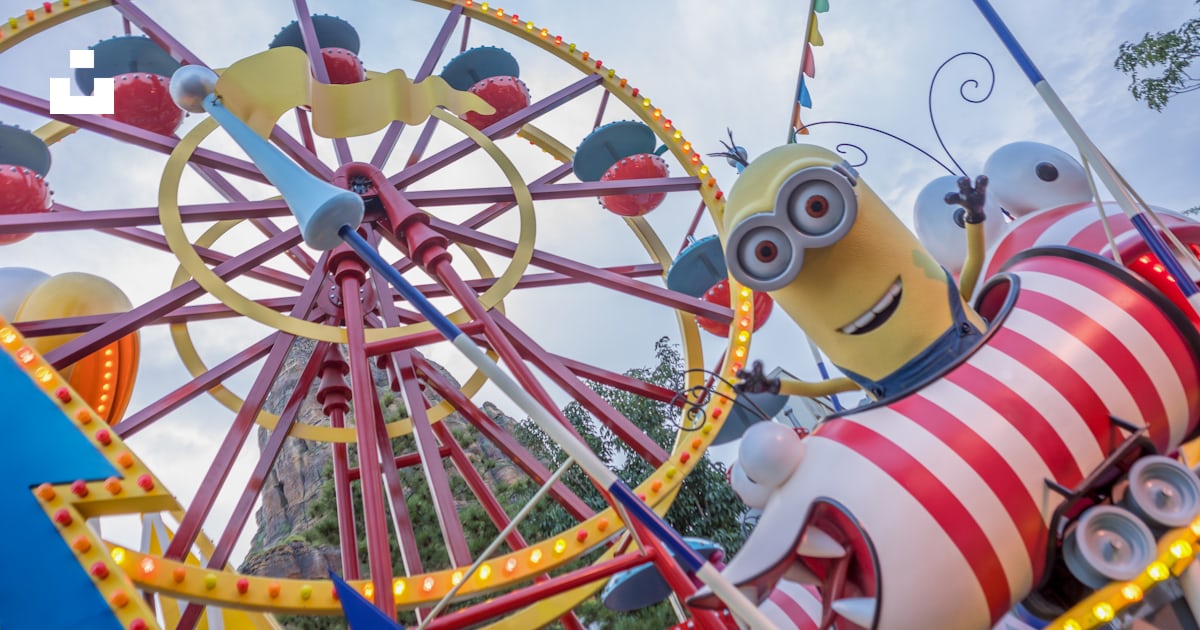 A ferris wheel and a minion ride at a carnival photo – Free Fun Image ...