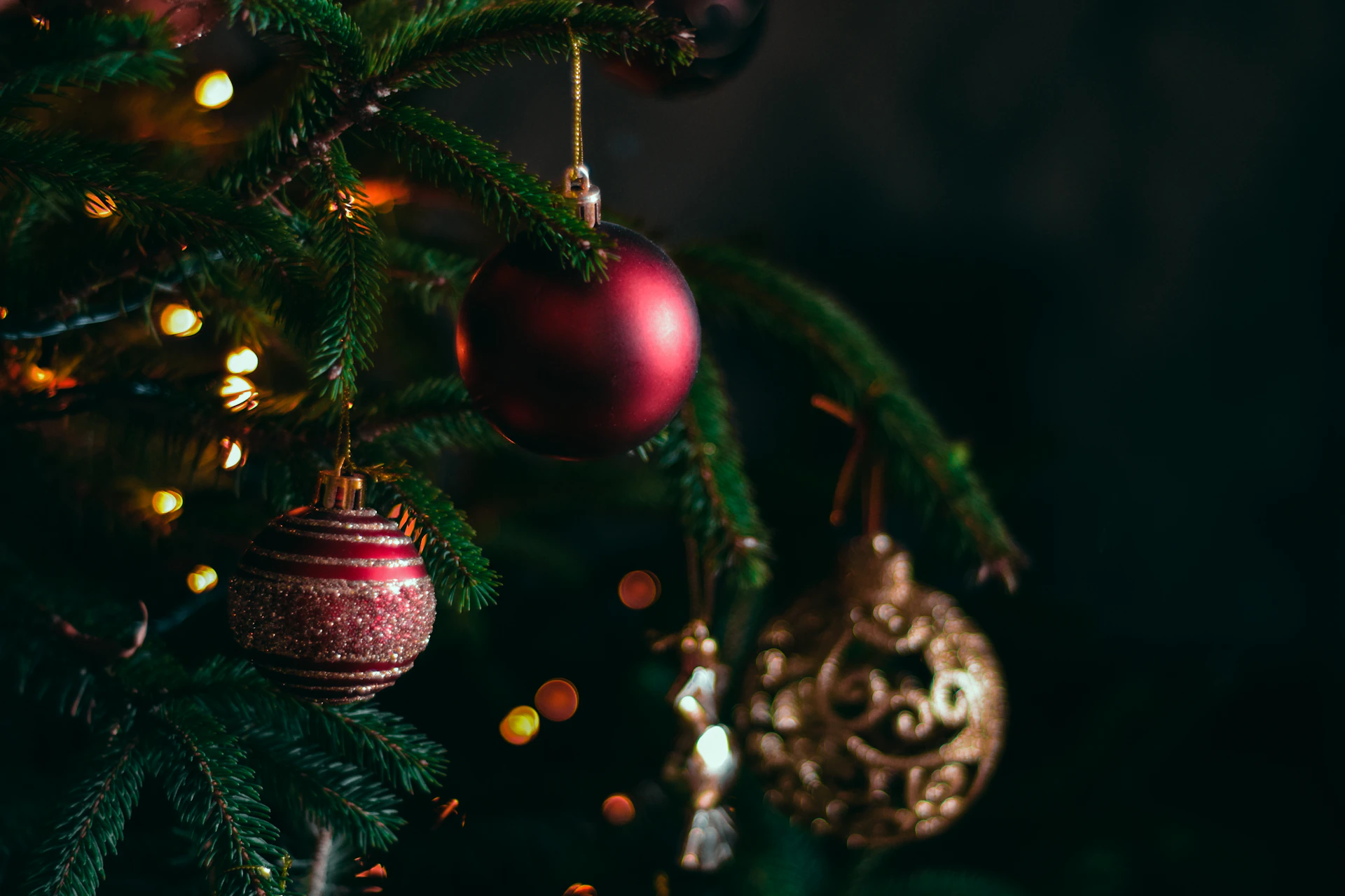 a christmas tree with ornaments hanging from it