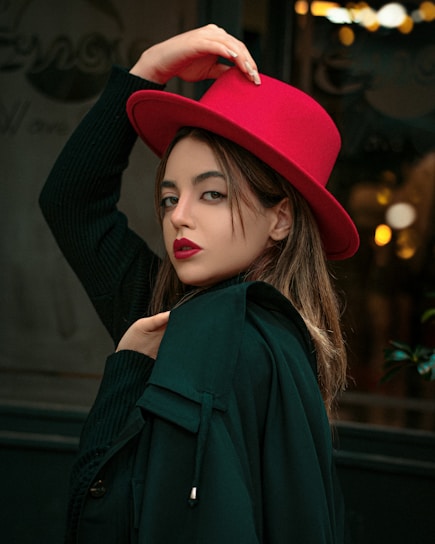 A dimly lit vintage street corner with a mysterious woman in a trench coat and red lipstick.