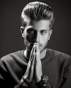 Portrait of Mr. Prince Jadhav in a stylish interior studio, reflecting creativity and professionalism.