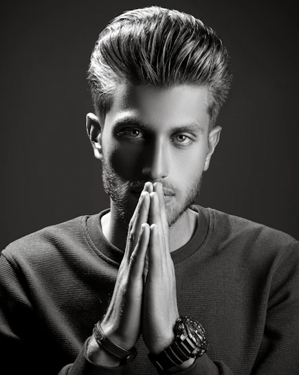 Portrait of Mr. Prince Jadhav in a stylish interior studio, reflecting creativity and professionalism.