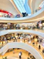 a mall filled with lots of people walking around