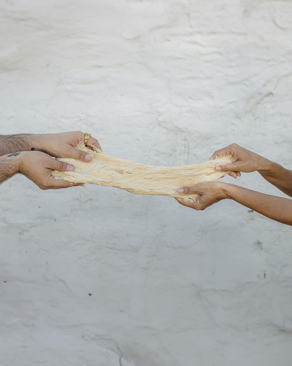 a group of people reaching out their hands to each other