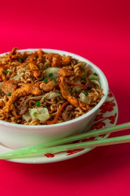 Colorful stir-fried vegetables and tender chicken served in a traditional Asian bowl.