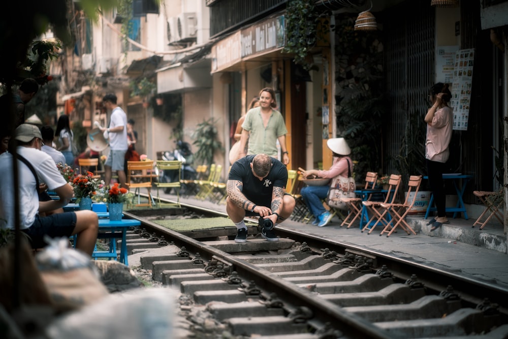 a man is working on a train track