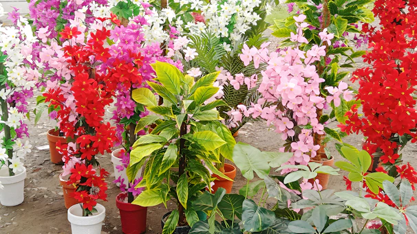 A stunning arrangement of artificial flowers in a stylish pot.