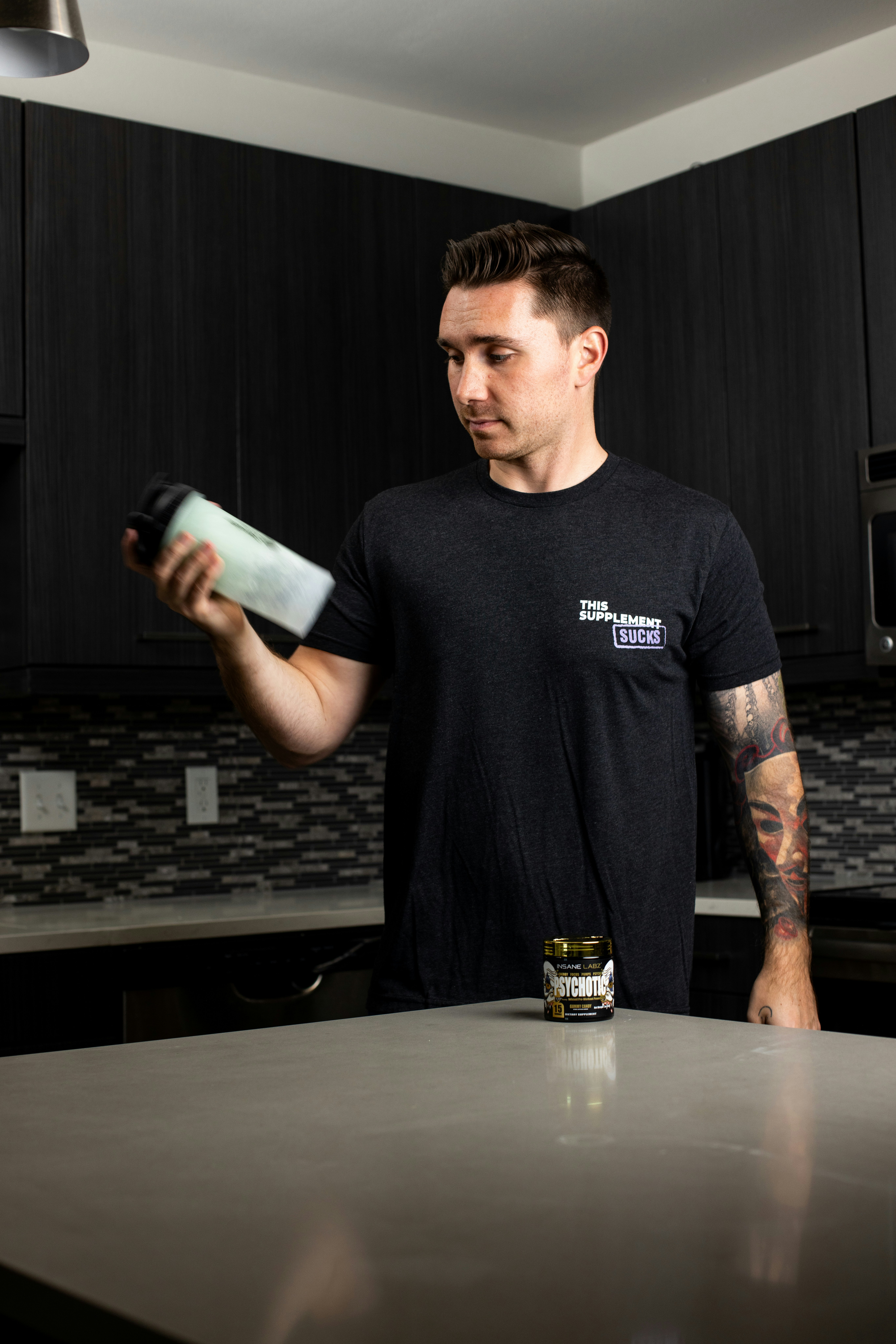 man drinking pre-workout