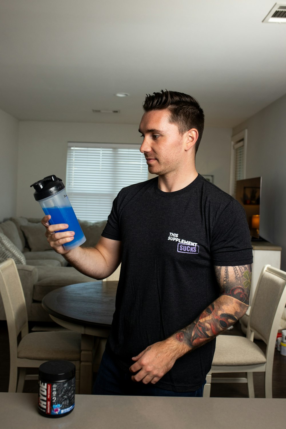 a man holding a water bottle in his hand